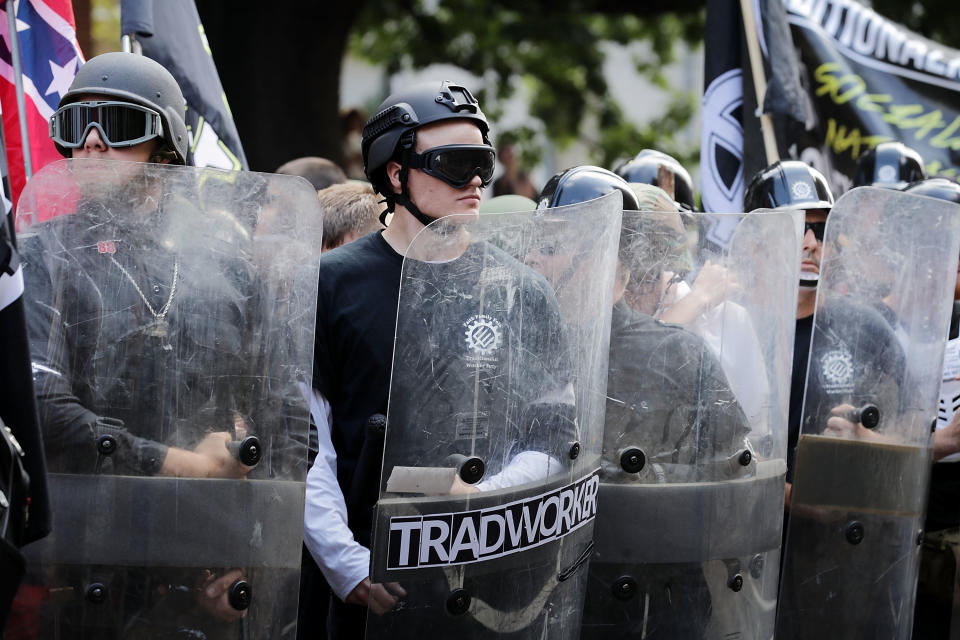 <p>Hundreds of white nationalists, neo-Nazis and members of the “alt-right” march down East Market Street toward Lee Park during the “Unite the Right” rally Aug.12, 2017 in Charlottesville, Va. (Photo: Chip Somodevilla/Getty Images) </p>