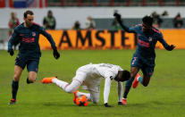 Soccer Football - Europa League Round of 16 Second Leg - Lokomotiv Moscow vs Atletico Madrid - RZD Arena, Moscow, Russia - March 15, 2018 Lokomotiv Moscow's Eder in action with Atletico Madrid's Thomas Partey REUTERS/Sergei Karpukhin