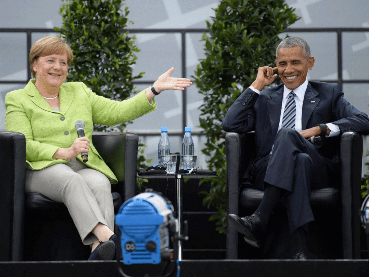 Angela Merkel and Barack Obama speaking in Berlin: EPA/CLEMENS BILAN