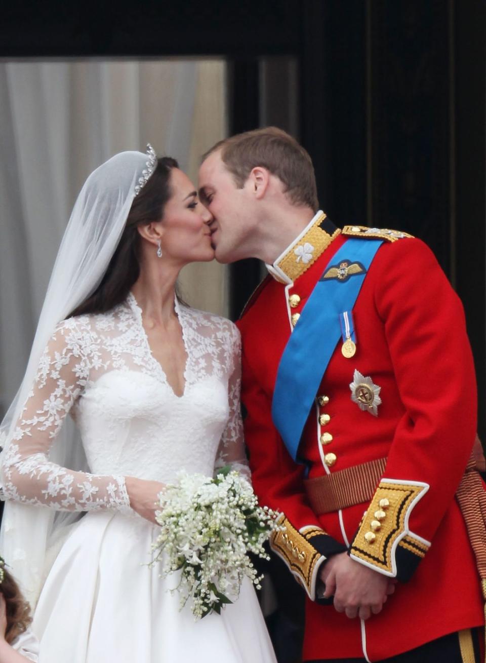 31) Kate Middleton and Prince William kiss on their wedding day, April 2011