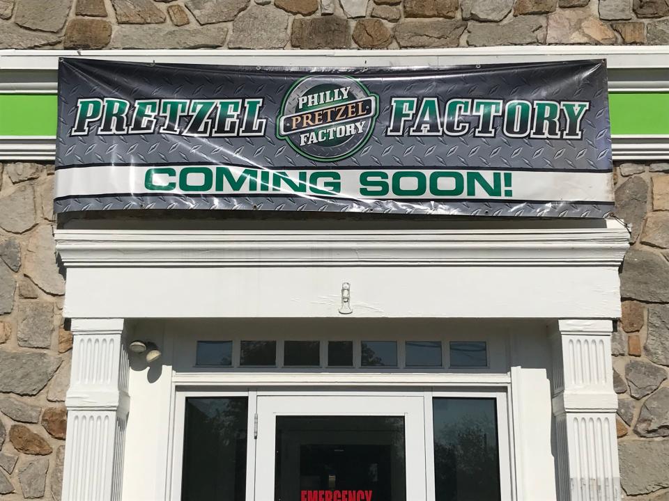 "Coming soon" says the sign for a Philly Pretzel Factory store in Rochester.