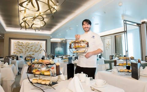 Eric Lanlard models afternoon tea on board Britannia - Credit: Steve Dunlop