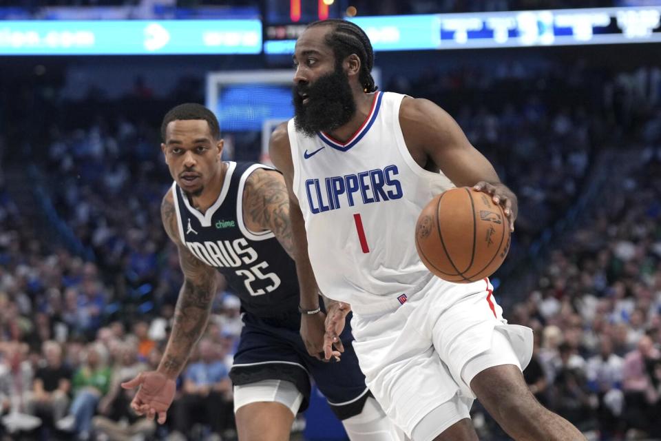 Clippers guard James Harden (1) drives past Mavericks forward P.J. Washington during Game 4.