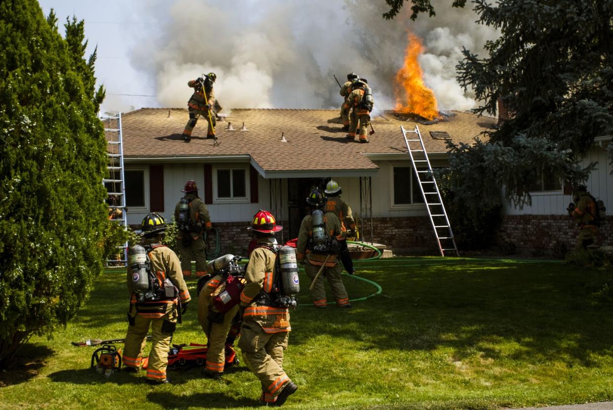 <span class="caption">The majority of fire-related deaths that occurred in 2020 took place in people's homes. </span> <span class="attribution"><a class="link " href="https://www.gettyimages.com/detail/news-photo/flames-vent-as-firefighters-work-to-put-out-the-flames-news-photo/1235064357?adppopup=true" rel="nofollow noopener" target="_blank" data-ylk="slk:Ty O'Neil/SOPA Images/LightRocket via Getty Images;elm:context_link;itc:0;sec:content-canvas">Ty O'Neil/SOPA Images/LightRocket via Getty Images</a></span>