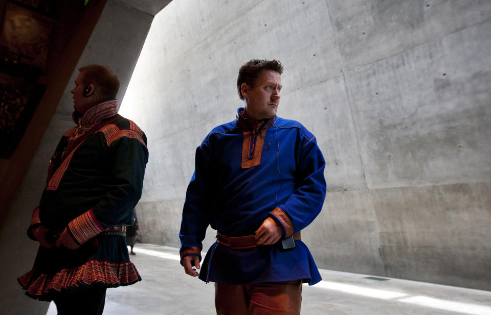 In this photo taken Tuesday, Feb. 21, 2012, Nils Ante Eira, left, and Lars Joar Halonen, Sami of Norway, visit the Yad Vashem Holocaust memorial in Jerusalem, as part of their stay in Israel, viewed by many as a model for reviving ancient tongues. A delegation of Norway's indigenous Sami people visited Israel this week, to seek help in preserving and expanding their fading native language. According to a senior researcher at the Academy of Hebrew Language the Sami are not the first foreigners to look to Israel for language instruction tips; visitors from the Maori tribes of New Zealand, from Wales and from the Basque region of Spain have come before. (AP Photo/Sebastian Scheiner)