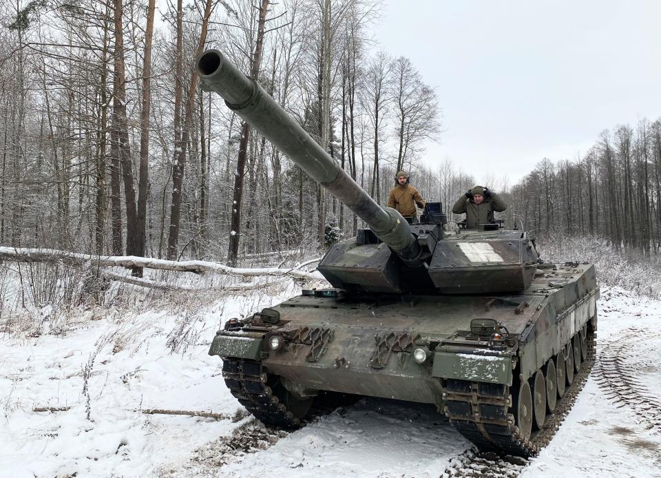 A Leopard 2A6 tank is seen in a forested training site in Lithuania.