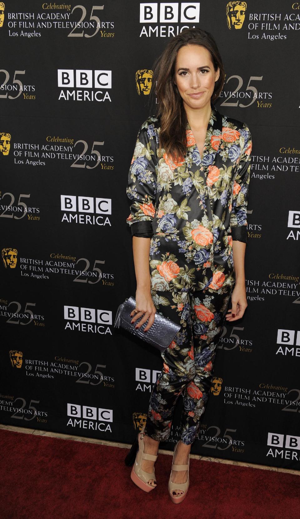 FILE - This Sept. 22, 2012 file photo shows Louise Roe, Glamour magazine's editor at large and the new host of NBC's "Fashion Star," posing at the British Academy of Film and Television Arts Los Angeles TV Tea 2012 party at The London Hotel in West Hollywood, Calif. (Photo by Chris Pizzello/Invision/AP, file)