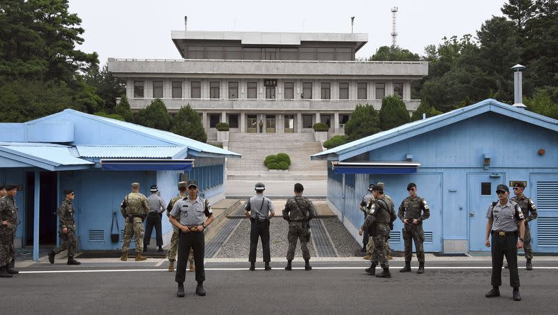Soldiers of South Korea and the U.S. stand guard during a commemorative ceremony for the 64th anniversary of the signing of the Korean War Armistice Agreement at the truce village of Panmunjom in the Demilitarized Zone dividing the two Koreas, on July 27, 2017. An American has crossed the heavily fortified border from South Korea into North Korea, the American-led U.N. Command overseeing the area said Tuesday, July 18, 2023, amid heightened tensions over North Korea’s nuclear program.
