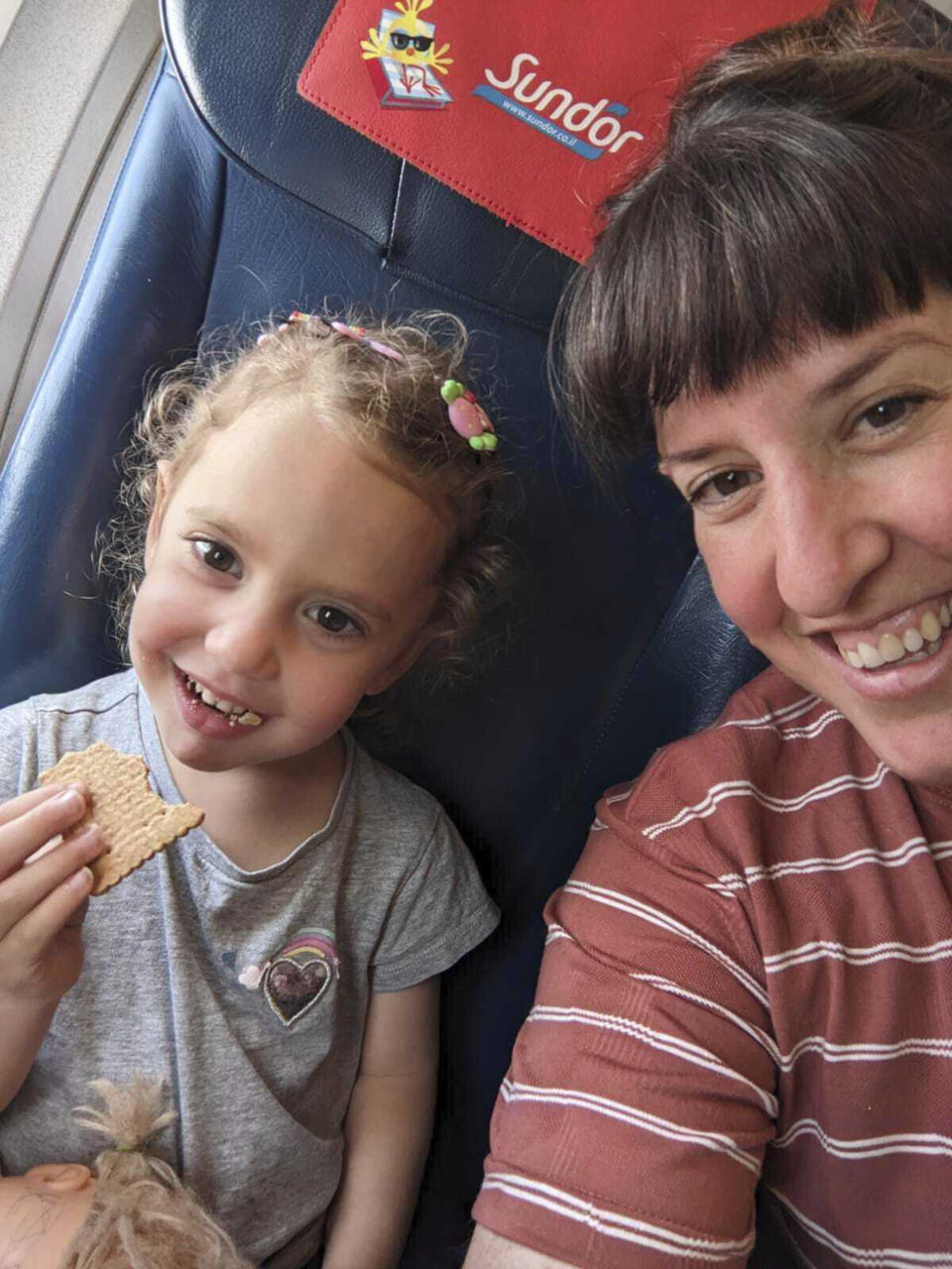 This undated family photo provided by Rachel Gur shows Yahel Shoham, 3, and her mother, Adi Shoham. They are believed to be hostages in Gaza in the wake of the Hamas attack on Kibbutz Be'eri, along with other family members. (Rachel Gur via AP)