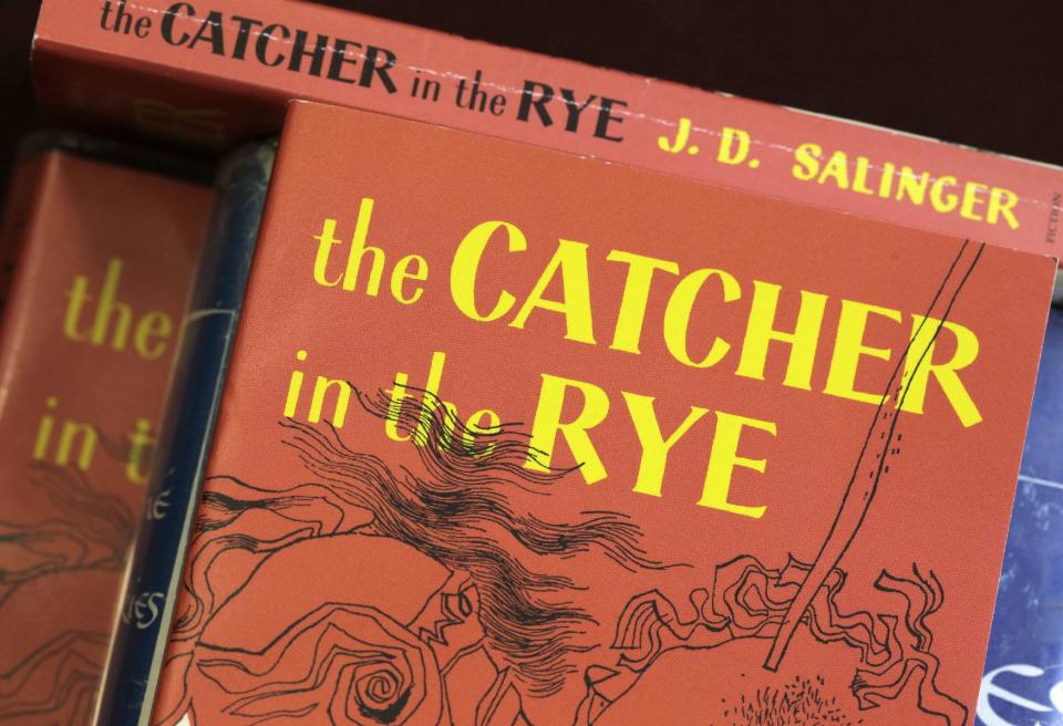 FILE - This Jan. 28, 2010, file photo, shows copies of J.D. Salinger's classic novel "The Catcher in the Rye" at the Orange Public Library in Orange Village, Ohio. Screenwriter Shane Salerno has taken on a surprising and news-making identity: the latest, and, apparently, greatest seeker of clues about J.D. Salinger. Salerno is presenting his case in “Salinger,” a unique, 3-way project: A 700-page book, co-authored with David Shields; a theatrical release distributed by the Weinstein Company; and a TV documentary that will air on PBS in January 2014 as the 200th installment of “American Masters.” (AP Photo/Amy Sancetta, File)