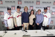 Baseball Hall of Fame inductees Edgar Martinez, left, Mike Mussina, and Mariano Rivera, right, pose for photographs with, Braden Halladay, third from left, Brandy Halladay, center, and Ryan Halladay, after a news conference Wednesday, Jan. 23, 2019, in New York. (AP Photo/Frank Franklin II)