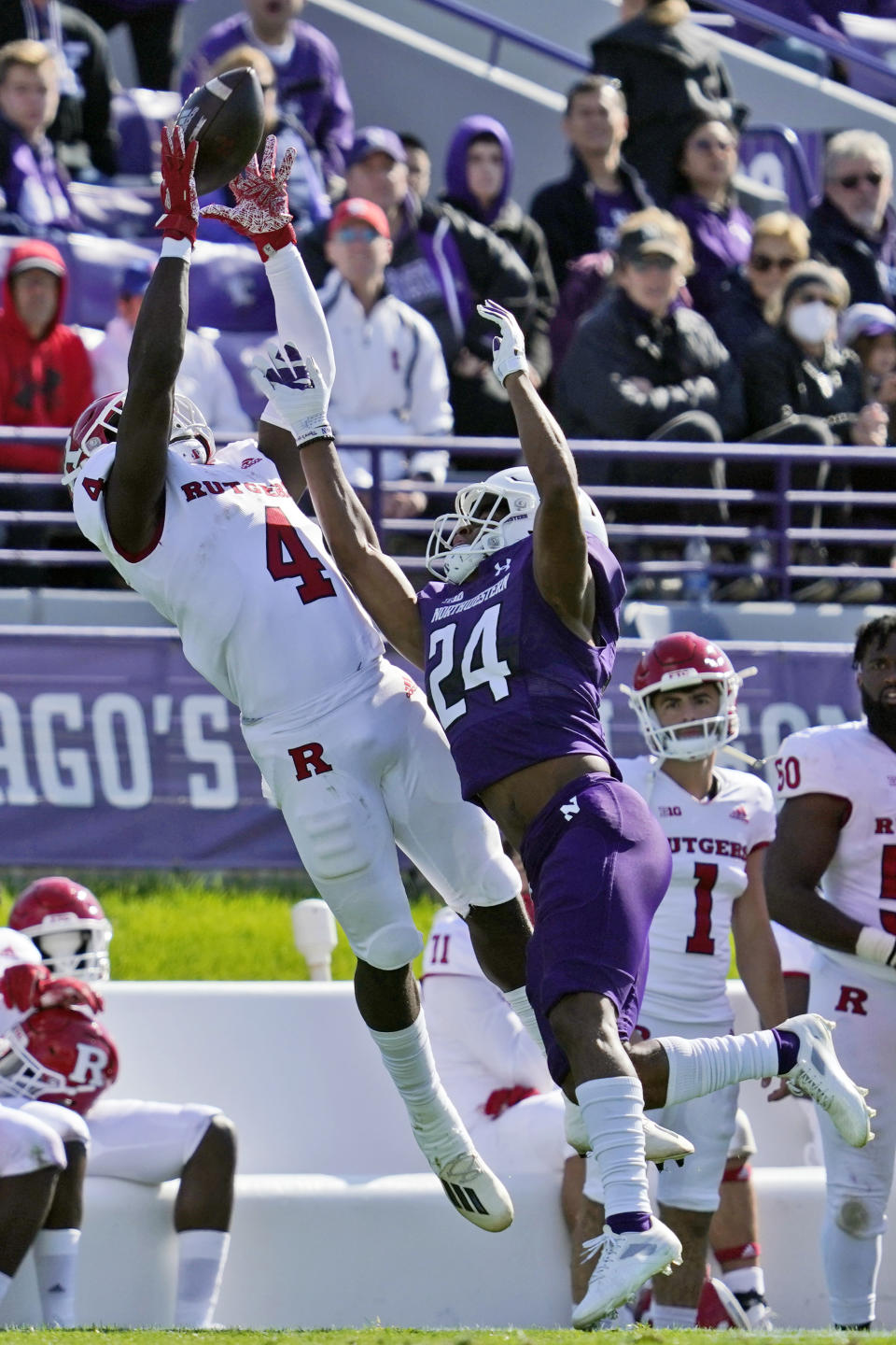 Rutgers running back Aaron Young, left, stretches for an incomplete pass against Northwestern defensive back Rod Heard II during the first half of an NCAA college football game in Evanston, Ill., Saturday, Oct. 16, 2021. (AP Photo/Nam Y. Huh)