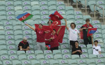 Fans cheer prior the start of the Euro 2020 soccer championship group A match between Turkey and Wales the Baku Olympic Stadium in Baku, Azerbaijan, Wednesday, June 16, 2021. (AP Photo/Darko Vojinovic, Pool)