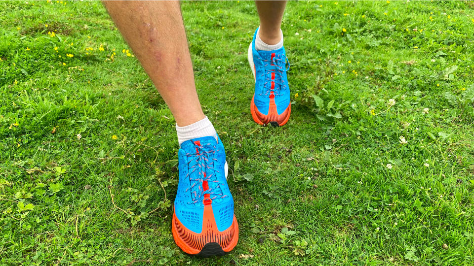 Man wearing Merrell Agility Peak 5 trail running shoes