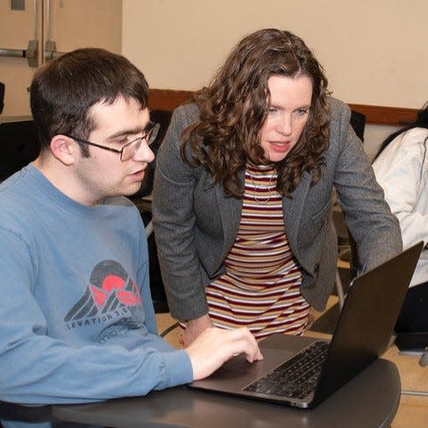 Ramapo College professor Sarah Koenig is assisting a student in her HIST 311/American West class in April 2023. Koenig received a $150,000 grant from the National Endowment for The Humanities in January.