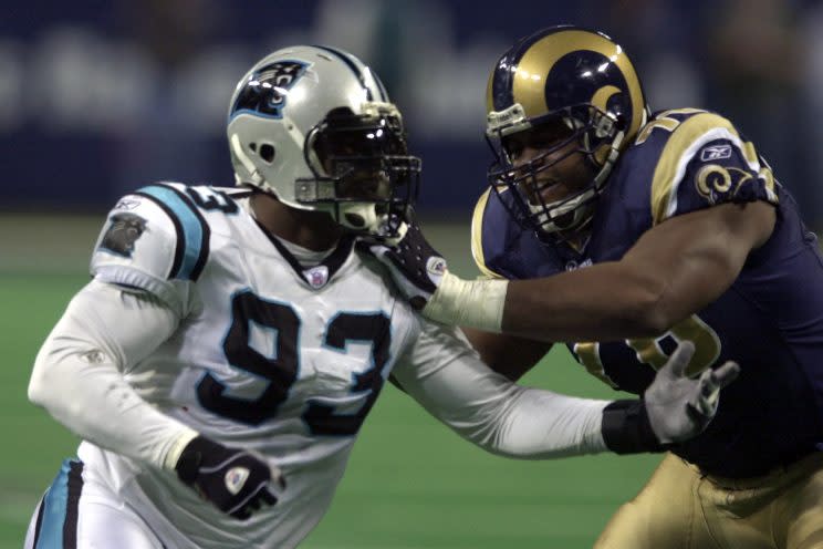 ** FOR USE AS DESIRED WITH 2004 SUPER BOWL STORIES ** Carolina Panthers defensive end Michael Rucker, left, rushes against the blocking of St. Louis Rams' Orlando Pace during the NFC divisional playoff game Saturday, Jan. 10, 2004, in St. Louis.The New England Patriots take on the Carolina Panthers in Super Bowl XXXVIII on Sunday, Feb. 1, 2004 in Houston. (AP Photo/Charles Rex Arbogast)