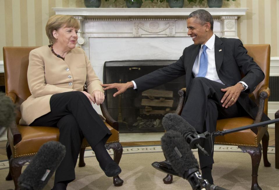 President Barack Obama meets with German Chancellor Angela Merkel in the Oval Office of the White House in Washington, Friday, May 2, 2014. Obama and Merkel are mounting a display of trans-Atlantic unity against an assertive Russia, even as sanctions imposed by Western allies seem to be doing little to change Russian President Vladimir Putin's reasoning on Ukraine. (AP Photo/Carolyn Kaster)