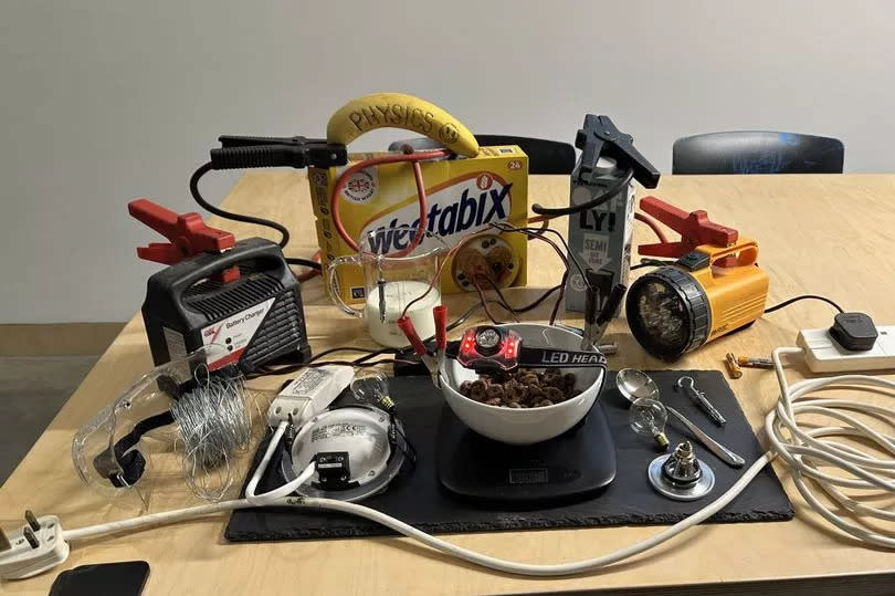 A physics themes breakfast with a bowl of cereal set up like an electronic circuit