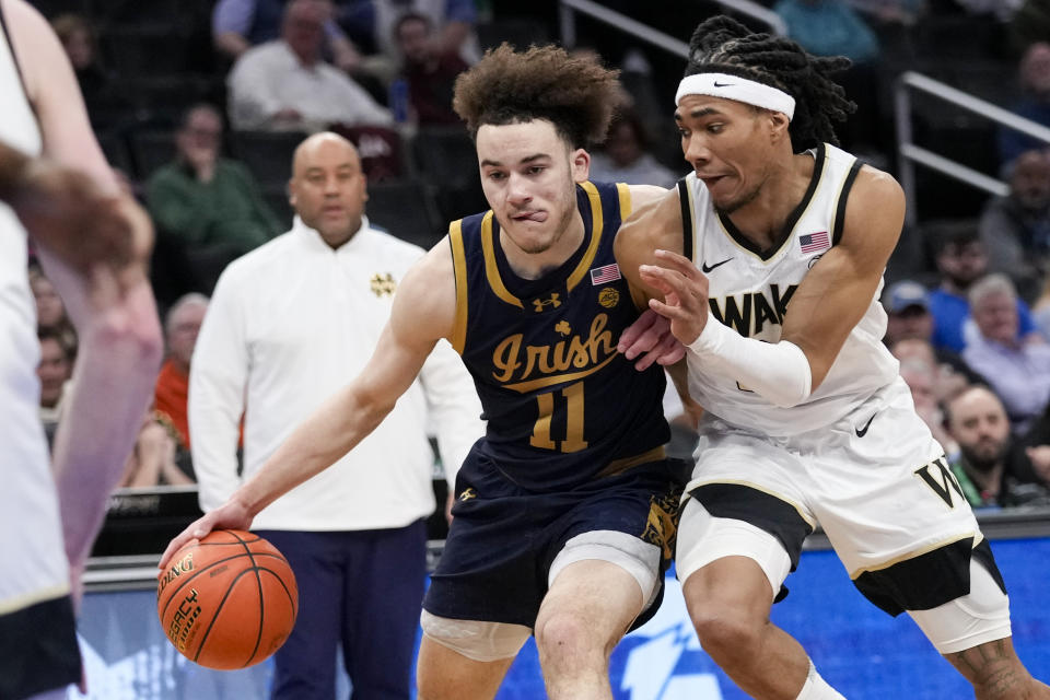 Notre Dame guard Braeden Shrewsberry (11) is guarded by Wake Forest guard Hunter Sallis (23) during the second half of the Atlantic Coast Conference second round NCAA college basketball tournament game Wednesday, March 13, 2024, in Washington. (AP Photo/Susan Walsh)