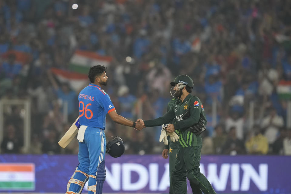 India's Shreyas Iyer shakes hands with Pakistan's Mohammad Rizwan following India's win in the ICC Men's Cricket World Cup match between India and Pakistan in Ahmedabad, India, Saturday, Oct. 14, 2023.(AP Photo/Rajanish Kakade)