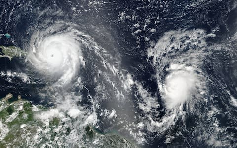 shows Hurricane Irma (L) and Hurricane Jose (R) in the Atlantic Ocean - Credit: EPA/NASA 