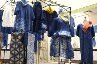 In this image from video, several clothes dyed by members of indigo dye group Japan Blue are displayed at a community center where residents evacuated when the 2011 earthquake hit the area in Minamisoma, Fukushima Prefecture, northeastern Japan, on Feb. 20, 2021. After the Fukushima nuclear plant disaster a decade ago, nearby farmers weren't allowed to grow crops for two years because of radiation. After the restriction was lifted, two farmers in the town of Minamisoma found an unusual way to rebuild their lives and help their destroyed community. Kiyoko Mori and Yoshiko Ogura planted indigo and soon began dying fabric with dye produced from the plants. (AP Photo/Chisato Tanaka)