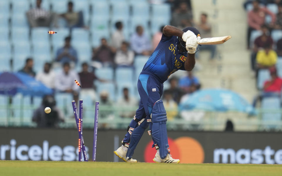 Sri Lanka's Kusal Perera bowled by Australia's captain Pat Cummins during the ICC Men's Cricket World Cup match between Australia and Sri Lanka in Lucknow, India, Monday, Oct. 16, 2023. (AP Photo/Aijaz Rahi)