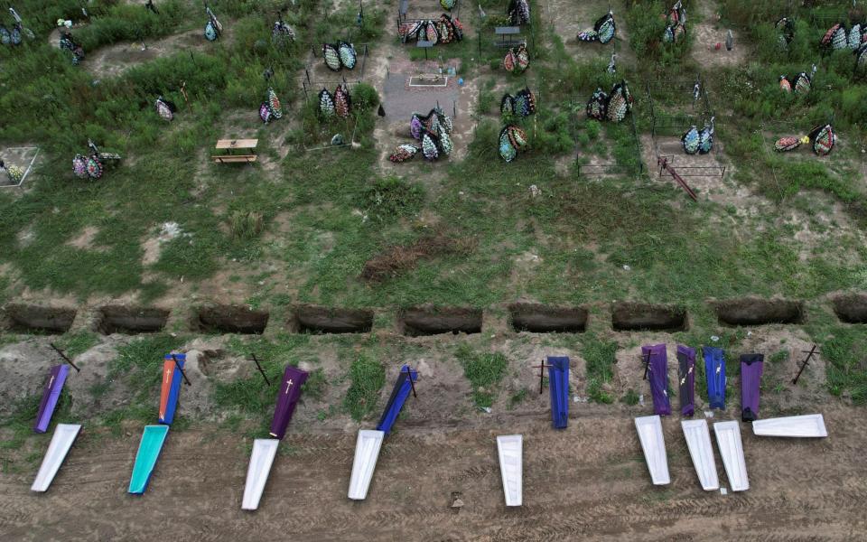 A mass burial of unidentified victims of the Bucha massacre - VALENTYN OGIRENKO/REUTERS