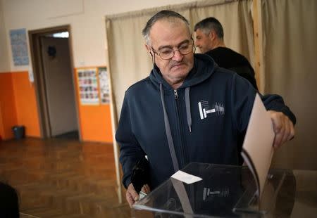 A man votes in a polling station during parliamentary elections in Sofia, Bulgaria March 26, 2017. REUTERS/Stoyan Nenov