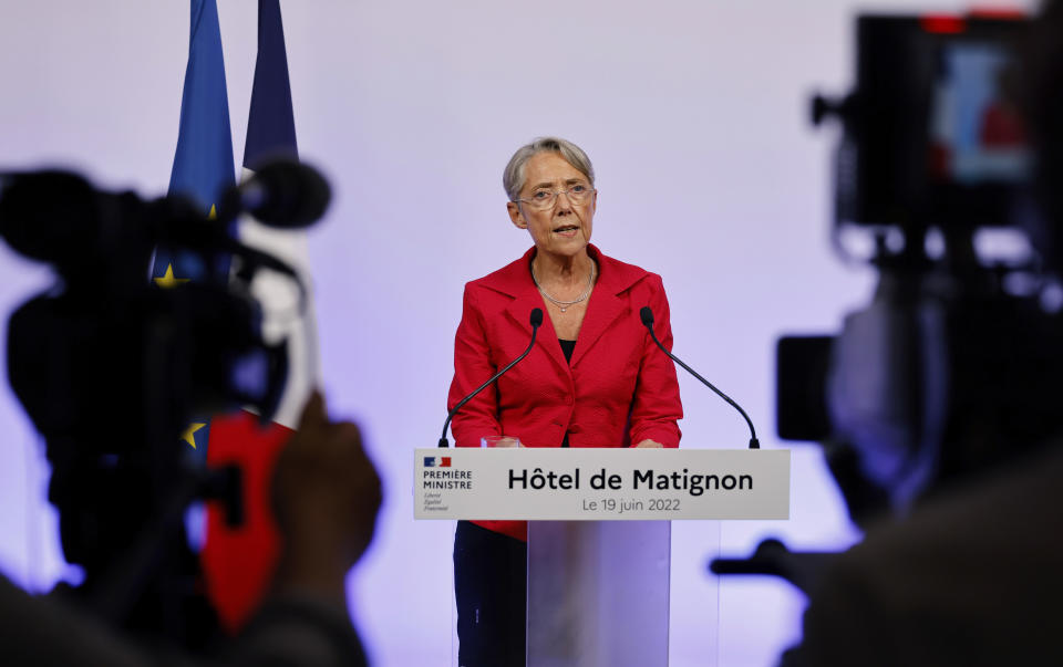 France's Prime Minister Elisabeth Borne gives a speech in Paris Sunday June 19, 2022. French President Emmanuel Macron's centrist alliance was projected to lose its majority despite getting the most seats in the final round of the parliamentary election Sunday, while the far-right National Rally appeared to have made big gains. A new coalition — made up of the hard left, the Socialists and the Greens — is projected to become the main opposition force with about 150 to 200 seats of the 577 members of the National Assembly. (Ludovic Marin, Pool via AP)