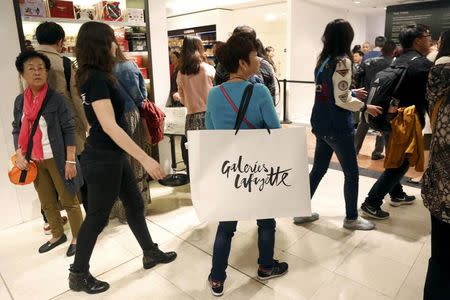 Customers visit the Galeries Lafayette department store in Paris, France, in this picture taken on September 23, 2015. Picture taken September 23, 2015. REUTERS/Charles Platiau/Files