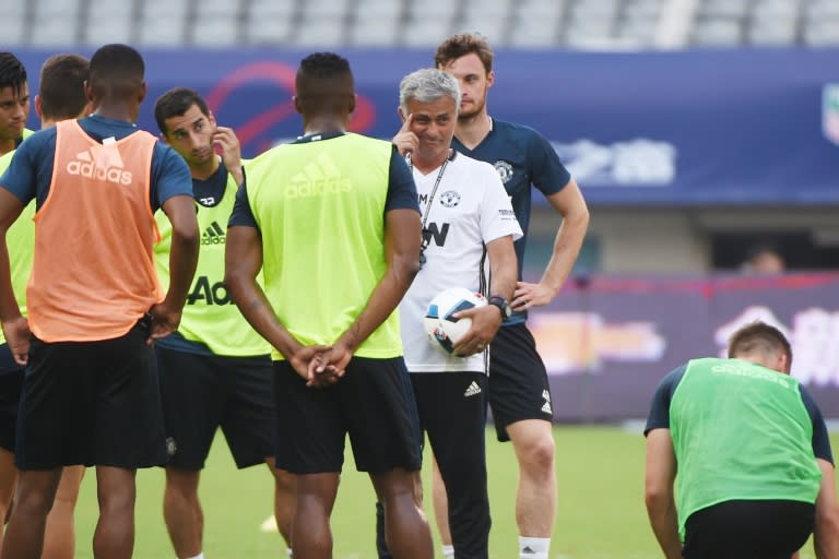 Manchester United's head coach Jose Mourinho (C) reacts as he takes part in a training session with teammates ahead of the 2016 International Champions Cup football match between Manchester United and Dortmund in Shanghai on July 21, 2016