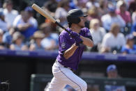 Colorado Rockies' Kyle Freeland follows the flight of his two-run single off Los Angeles Dodgers starting pitcher Max Scherzer in the second inning of a baseball game Thursday, Sept. 23, 2021, in Denver. (AP Photo/David Zalubowski)