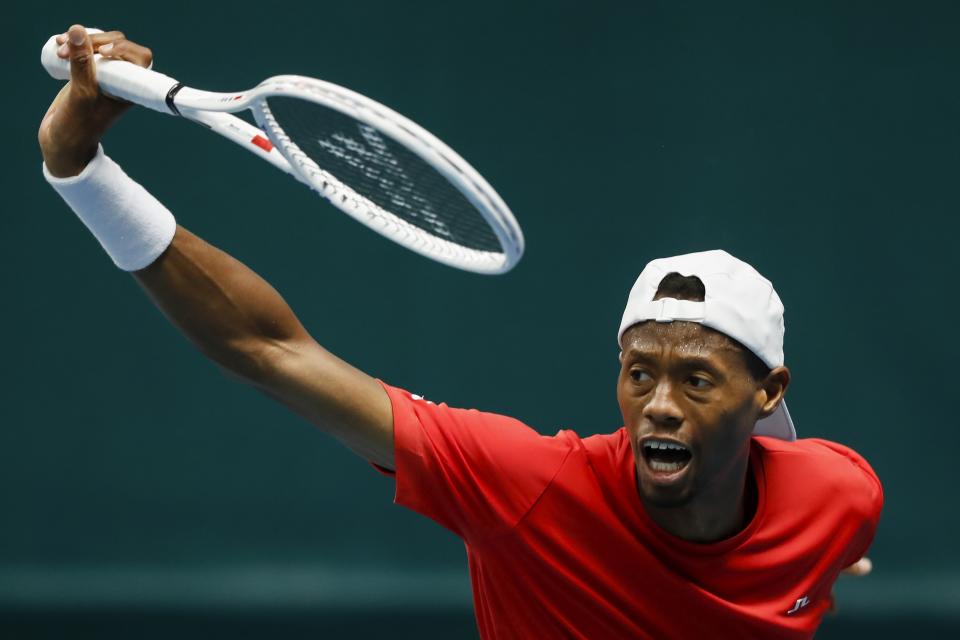 Christopher Eubanks of the USA reacts returning the ball to Viacheslav Bieliskyi of Ukraine during a Davis Cup qualifier tennis match between Ukraine and USA in Vilnius, Lithuania, Thursday, Feb. 1, 2024. (AP Photo/Mindaugas Kulbis)