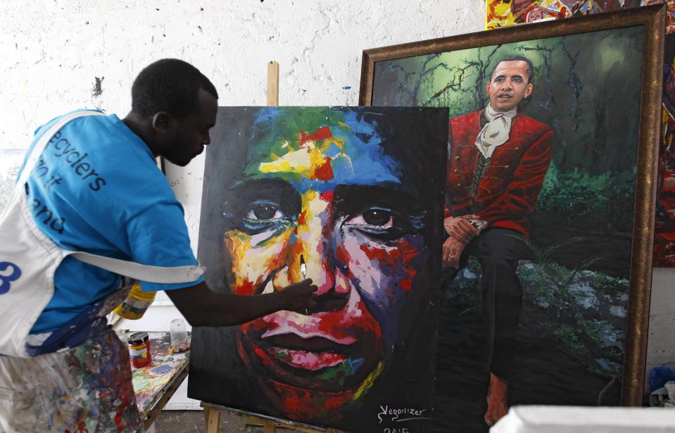Kenyan artist Yegon alias "Yegonizer" works on a portrait of U.S. President Obama at a studio in Nairobi