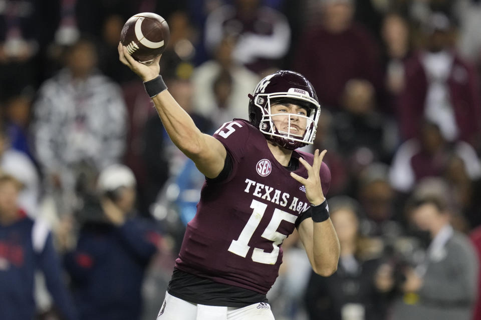 Texas A&M quarterback Conner Weigman (15) throws down field against Mississippi during the third quarter of an NCAA college football game Saturday, Oct. 29, 2022, in College Station, Texas. (AP Photo/Sam Craft)