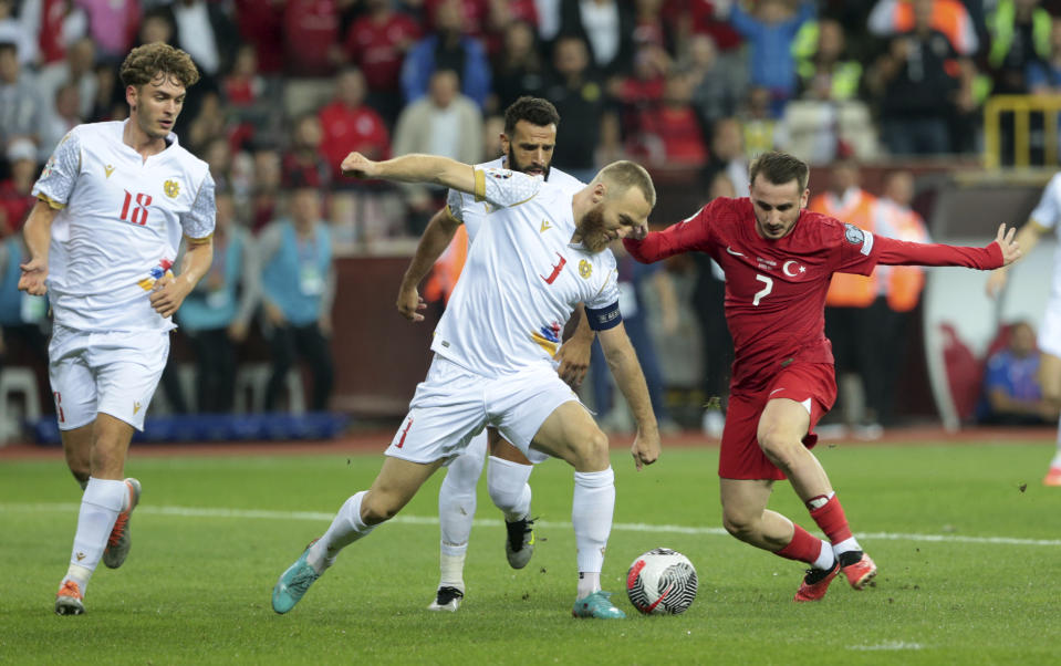 Armenia's Varazdat Haroyan vies for the ball with Turkey's Muhammed Kerem Akturkoglu, right, during the Euro 2024 group D qualifying soccer match between Turkey and Armenia at Yeni Eskisehir Ataturk stadium in Eskisehir, Turkey, Friday, Sept. 8, 2023. (Huseyin Yavuz/Dia Images via AP)