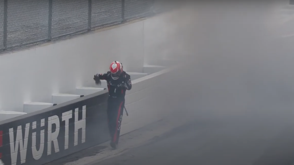 a person in a helmet standing in a foggy room