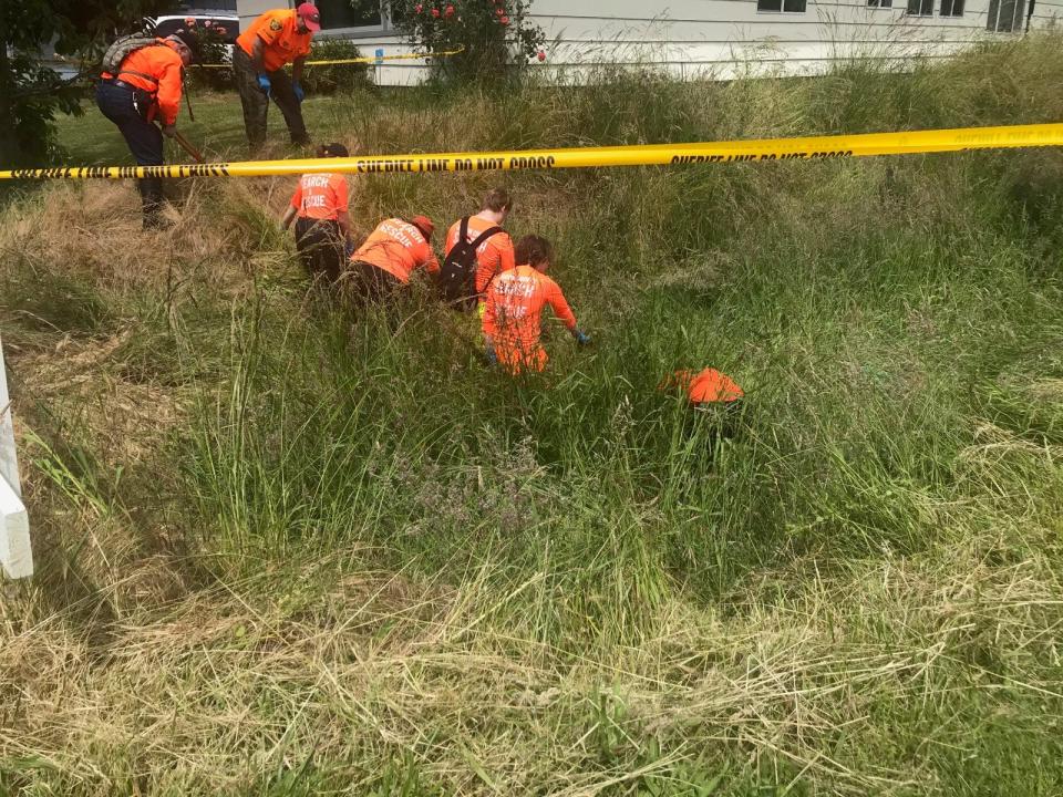 Detectives from the Marion County Sheriff’s Office investigate human remains discovered beneath a duplex in northeast Salem on June 10, 2020.