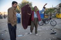 <p>A man reacts following an earthquake in Sarpol-e Zahab county in Kermanshah, Iran Nov. 13, 2017. (Photo: Tasnim News Agency/Reuters) </p>