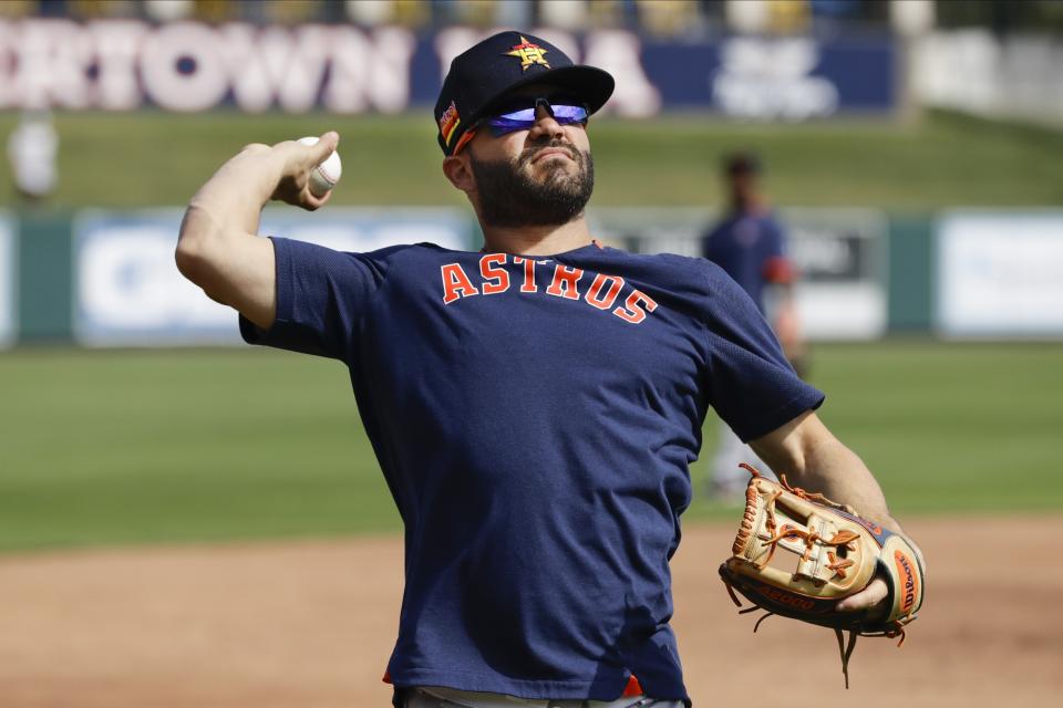 Houston Astros' Jose Altuve warms up before a spring training baseball game against the Detroit Tigers Monday, Feb. 24, 2020, in Lakeland, Fla. (AP Photo/Frank Franklin II)