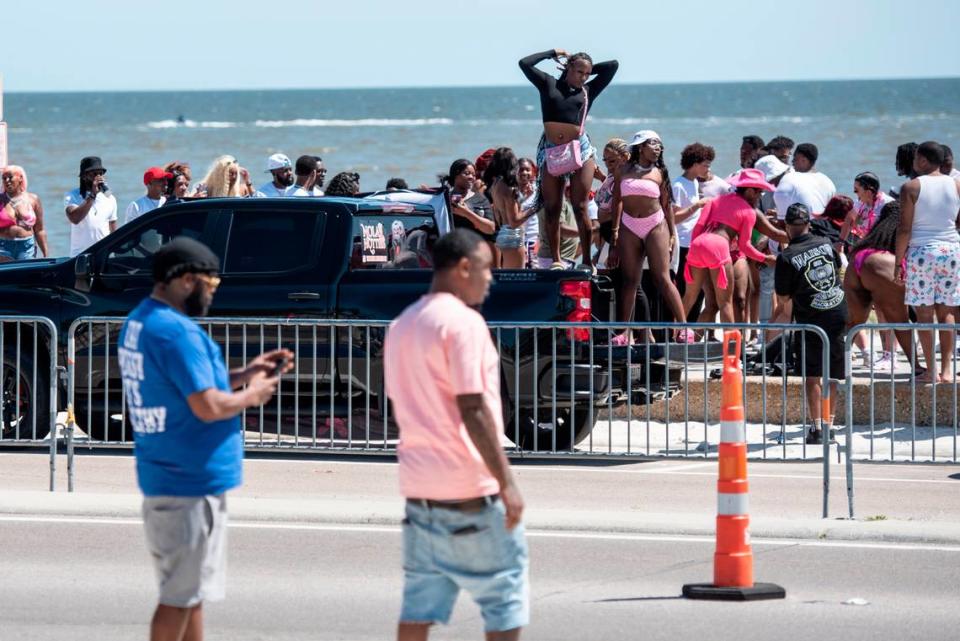 Spring breakers dance next to Biloxi Beach during Black Spring Break in Biloxi on Saturday, April 13, 2024