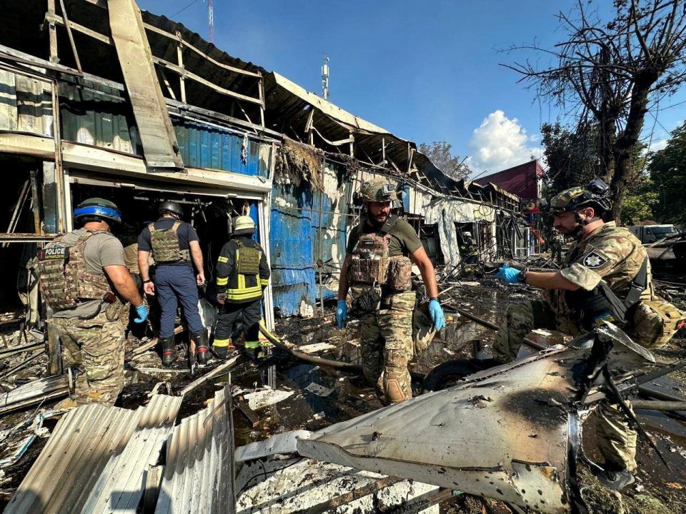 Police officers and rescuers inspect the site of a Russian military strike in Kostiantynivka, Donetsk region (via REUTERS)