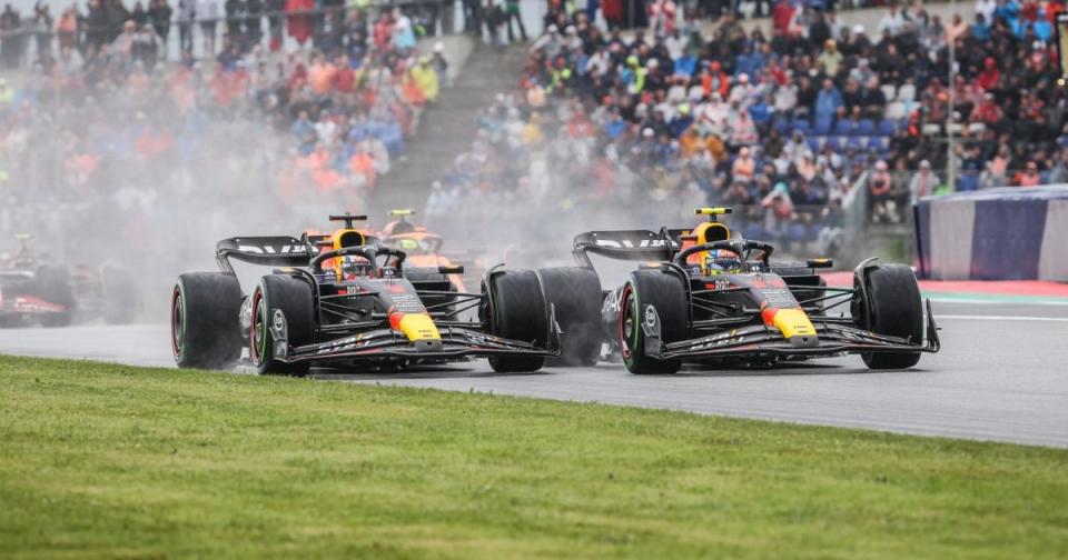 Max Verstappen takes to the grass in battle with Red Bull team-mate Sergio Perez on the opening lap of the Austrian Grand Prix sprint race. Styria, July 2023. Credit: Alamy