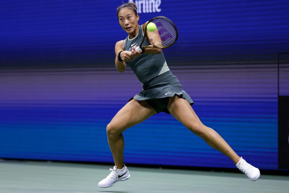 Zheng Qinwen, of China, returns to Aryna Sabalenka, of Belarus, during the quarterfinals of the U.S. Open tennis championships, Tuesday, Sept. 3, 2024, in New York. (AP Photo/Adam Hunger) (AP)