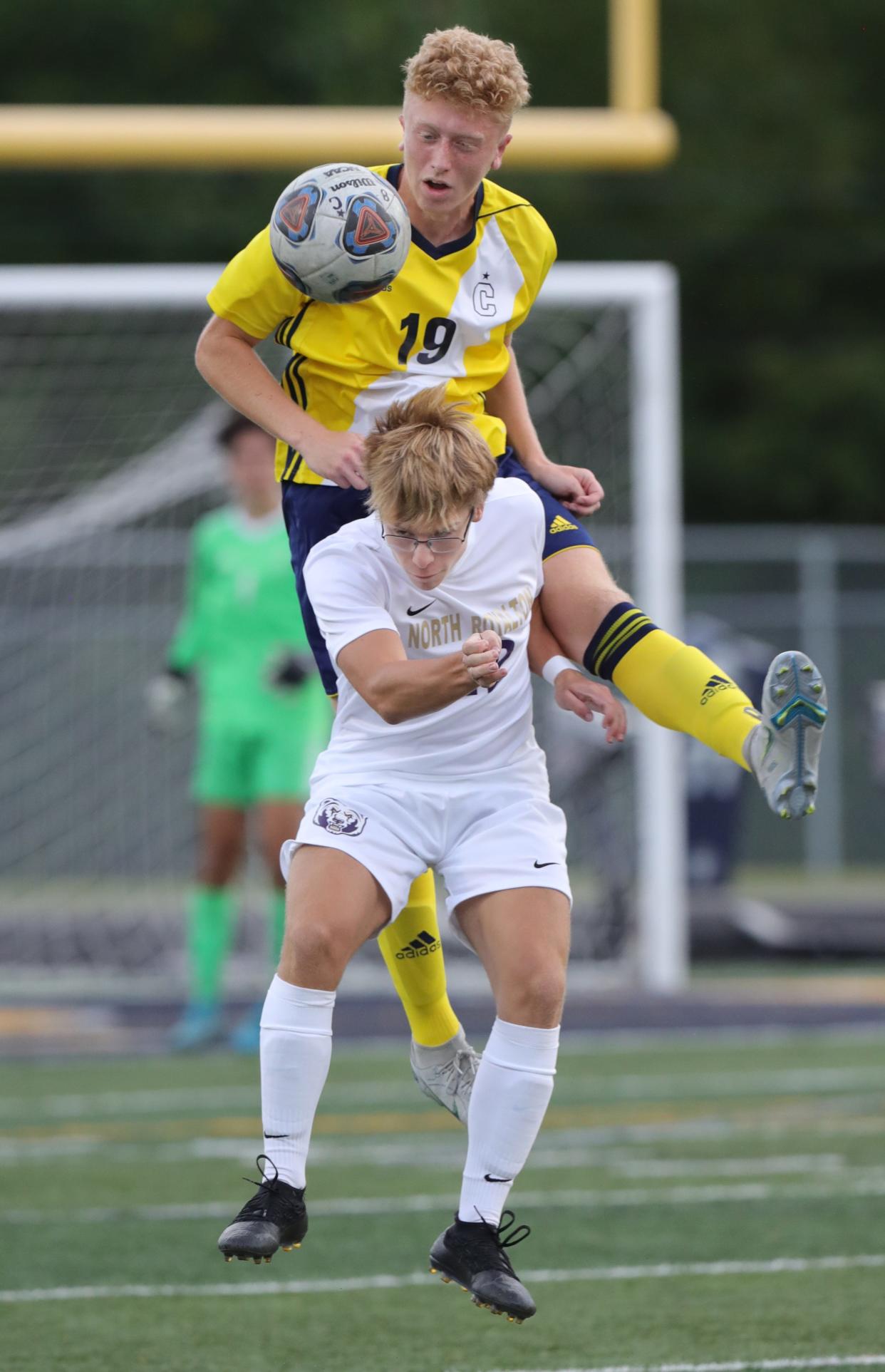 Copley's Asher Hart heads the ball over North Royalton's Tommy Joniec on Thursday, Aug. 25, 2022 in Copley.