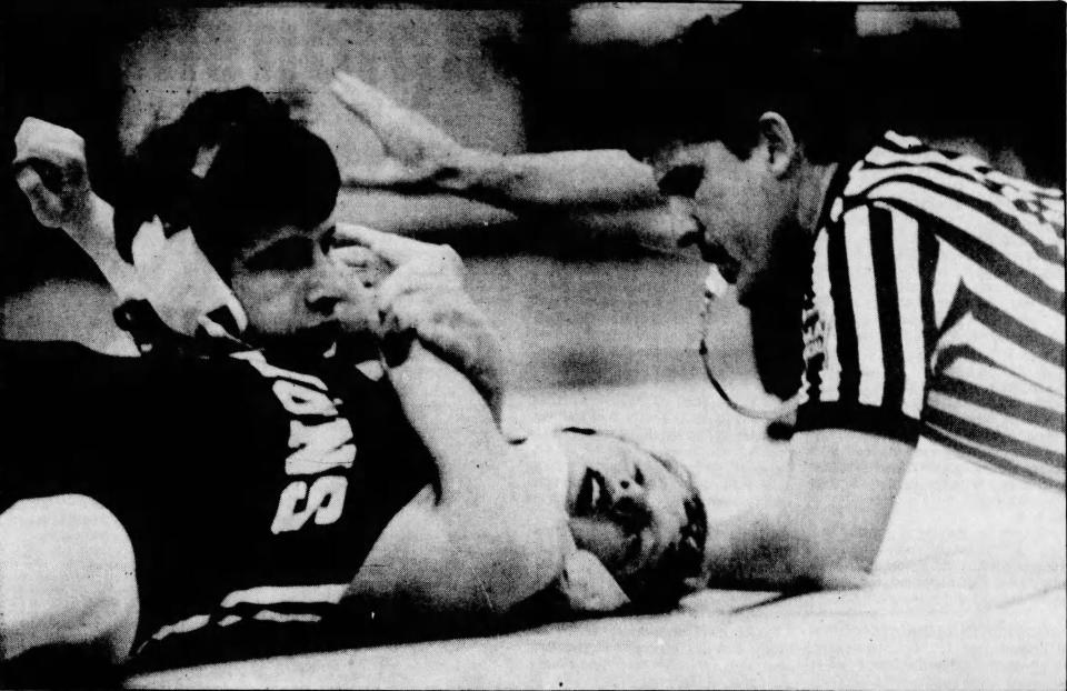 Bermudian Springs' Trevor Byers (top) gets back points against Camp Hill's Chad Gallaher in the 199-pound title bout at the District III Class AA Section I Tournament Saturday, February 24, 1985. Byers pinned Gallaher for the title.