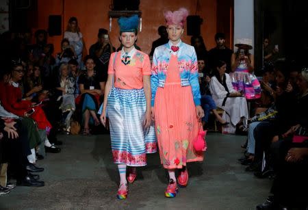 Models present creations by Indian designer Manish Arora as part of his Spring/Summer 2017 women's ready-to-wear collection during Fashion Week in Paris, France September 29, 2016. REUTERS/Gonzalo Fuentes