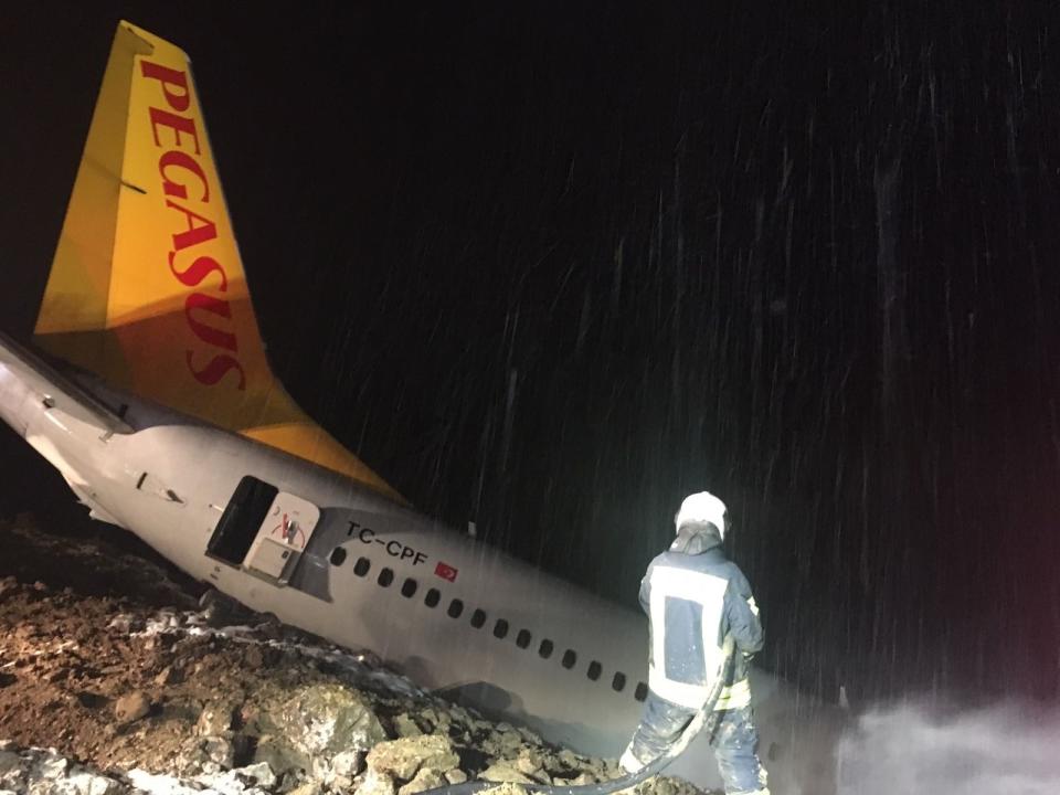 <p>A Pegasus airplane carrying 162 passengers is seen stuck in mud as it skidded off the runway after landing in Trabzon Airport, Turkey early Sunday on Jan. 14, 2018. (Photo: Tugba Yardimci/Anadolu Agency/Getty Images) </p>