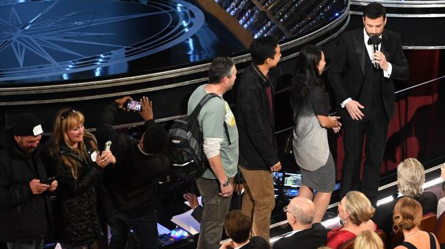 A group of tourists thought they'd accidentally crashed the Oscars, but it had been set up by Jimmy Kimmel. Source: Getty